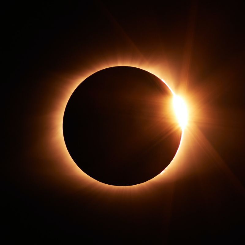 Solar eclipse with a glowing golden corona